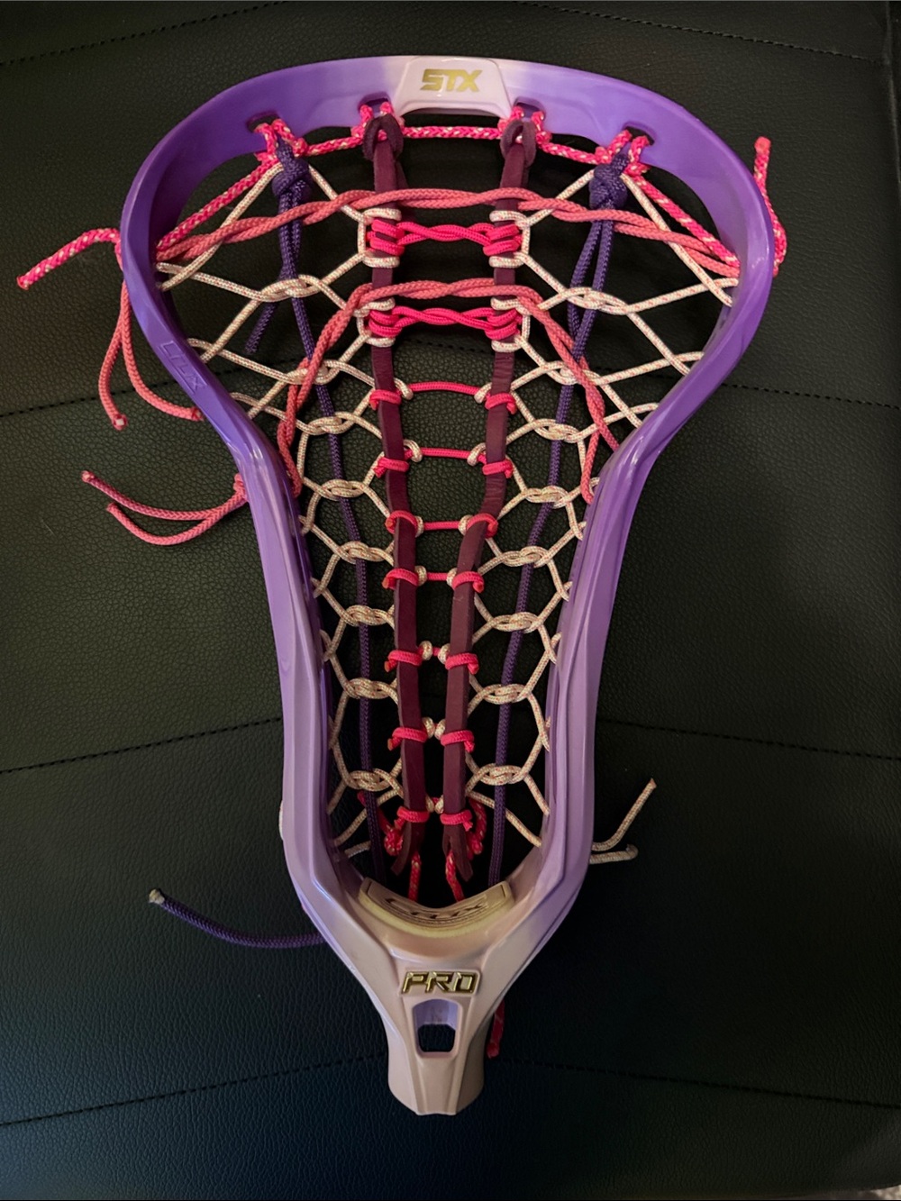 STX Pro Lacrosse Head in Purple with Pink Stringing